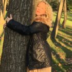 Kelley hugging tree for Rejuvenate and Reconnect in Nature by Kelley Grimes at Cultivating Peace and Joy