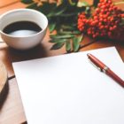 Image of blank page with pen to signify self-reflection