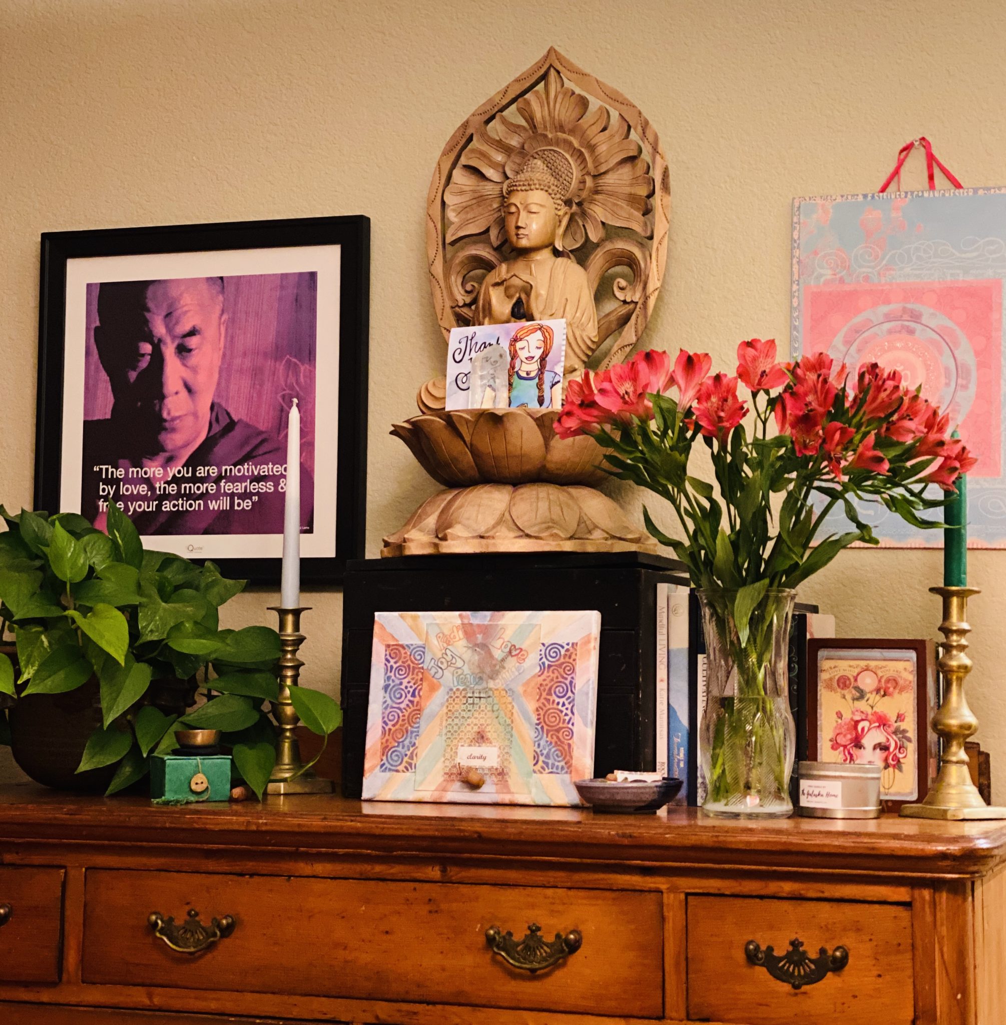 Image of Buddha, art, and flowers representing self-nurturing